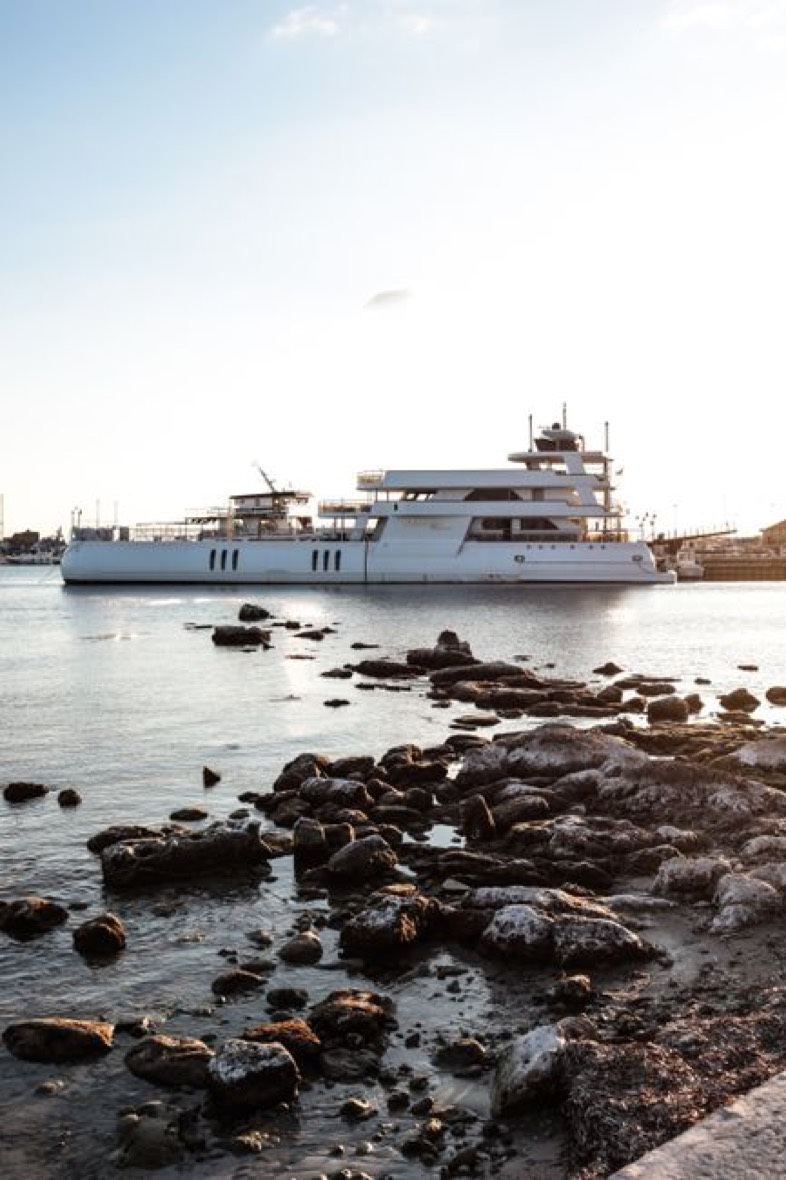 Private yacht anchored on the bay at golden hour