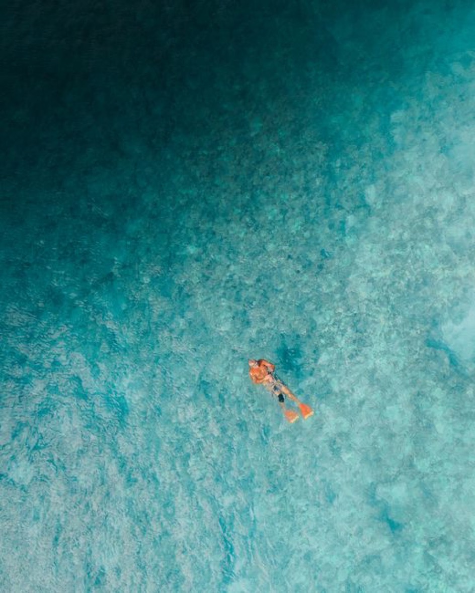 Snorkeling over a reef in clear turquoise water